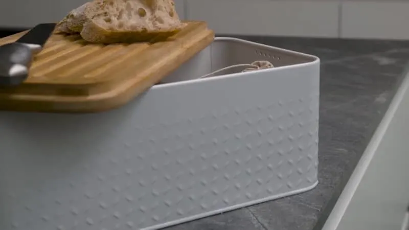 Bread bin with holes or vents.