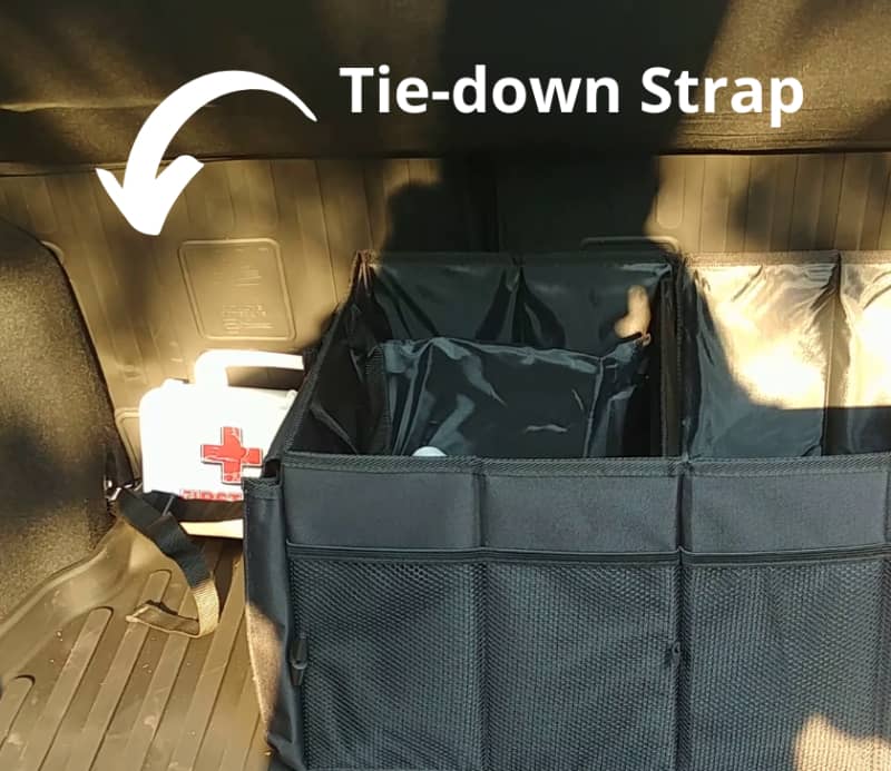 Get a Tie-down Strap for your trunk organizer.
